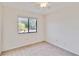 Well-lit bedroom with carpet flooring and window at 20096 Tappan Zee Dr, Port Charlotte, FL 33952