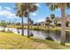 Peaceful canal view with lush landscaping and homes at 20096 Tappan Zee Dr, Port Charlotte, FL 33952