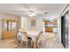Open dining area with kitchen view and wood-look floors at 20096 Tappan Zee Dr, Port Charlotte, FL 33952
