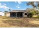 Single-story home with screened porch and yard at 20096 Tappan Zee Dr, Port Charlotte, FL 33952