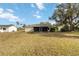 Single-story home with screened porch and yard at 20096 Tappan Zee Dr, Port Charlotte, FL 33952