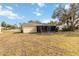 Single-story home with screened porch and yard at 20096 Tappan Zee Dr, Port Charlotte, FL 33952