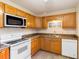 Well-equipped kitchen featuring wood cabinets and granite counters at 20096 Tappan Zee Dr, Port Charlotte, FL 33952