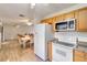 Efficient kitchen with white appliances and wood cabinets at 20096 Tappan Zee Dr, Port Charlotte, FL 33952
