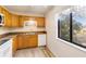 Bright kitchen with wood cabinets and a window view at 20096 Tappan Zee Dr, Port Charlotte, FL 33952