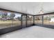 Bright sunroom with view of backyard and surrounding landscape at 20096 Tappan Zee Dr, Port Charlotte, FL 33952