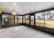 Bright sunroom with view of backyard and surrounding landscape at 20096 Tappan Zee Dr, Port Charlotte, FL 33952
