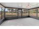 Bright sunroom with view of backyard and surrounding landscape at 20096 Tappan Zee Dr, Port Charlotte, FL 33952