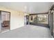 Bright sunroom with grey carpet and multiple windows at 20096 Tappan Zee Dr, Port Charlotte, FL 33952