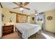 Nautical-themed bedroom featuring a large bed, ceiling fans, and plenty of natural light at 217 46Th W St, Bradenton, FL 34209