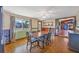 Bright dining room with parquet floors, a ceiling fan, and natural light from the window at 217 46Th W St, Bradenton, FL 34209