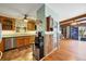 Functional kitchen featuring wood cabinets, modern appliances, and convenient access to the living area at 217 46Th W St, Bradenton, FL 34209