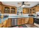 Charming kitchen with wood cabinets, updated appliances, and ample counter space at 217 46Th W St, Bradenton, FL 34209