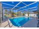 Sparkling pool, screened-in, with clear blue water, surrounded by a spacious deck and relaxing lounge area at 217 46Th W St, Bradenton, FL 34209