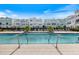 Resort-style community pool with plenty of lounge chairs at 2462 Mangum Ct, Sarasota, FL 34237