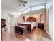 Main bedroom with wood flooring and a king-size bed at 2468 Quail Ter, Port Charlotte, FL 33981