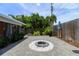 Landscaped backyard with fire pit and patio at 2502 Alpine Ave, Sarasota, FL 34239
