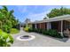 Landscaped backyard with fire pit and patio at 2502 Alpine Ave, Sarasota, FL 34239