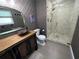 Updated bathroom with a walk-in shower and stylish vanity at 2502 Alpine Ave, Sarasota, FL 34239