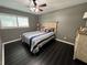 Cozy bedroom with a nautical theme and dark hardwood floors at 2502 Alpine Ave, Sarasota, FL 34239