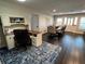 Bright dining room with hardwood floors and a view into the home office at 2502 Alpine Ave, Sarasota, FL 34239