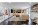 L-shaped sectional sofa, hardwood floors, built-in shelving, fireplace at 2502 Alpine Ave, Sarasota, FL 34239