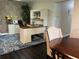 Dedicated home office with an L-shaped desk, built-in hutch, and area rug at 2502 Alpine Ave, Sarasota, FL 34239