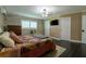 Main bedroom with dark hardwood floors and stone accent wall at 2502 Alpine Ave, Sarasota, FL 34239
