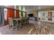 Sunroom with tiled floors, dining table, and French doors at 2502 Alpine Ave, Sarasota, FL 34239