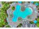 Aerial view of a unique freeform pool with lap lanes at 26954 Pavin Dr, Englewood, FL 34223