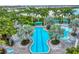 Relaxing aerial view of a resort-style pool with lounge chairs at 26954 Pavin Dr, Englewood, FL 34223