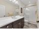 Clean bathroom with single vanity and shower/tub combo at 26954 Pavin Dr, Englewood, FL 34223