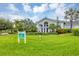 Resort-style clubhouse with lush landscaping and palm trees at 26954 Pavin Dr, Englewood, FL 34223