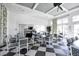 Bright community room with tables, chairs, and a checkerboard floor at 26954 Pavin Dr, Englewood, FL 34223