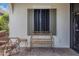Inviting front porch with a bench and comfortable seating at 26954 Pavin Dr, Englewood, FL 34223
