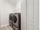 Convenient laundry room with washer and dryer at 26954 Pavin Dr, Englewood, FL 34223