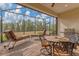 Relaxing screened lanai with outdoor furniture and grill at 26954 Pavin Dr, Englewood, FL 34223