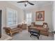 Cozy sitting room featuring a comfortable sofa and side table at 26954 Pavin Dr, Englewood, FL 34223