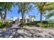 Tennis center building with lush landscaping at 26954 Pavin Dr, Englewood, FL 34223