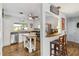 Galley kitchen with white cabinets, stainless steel appliances, and butcher block island at 305 51St W St, Bradenton, FL 34209