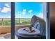 Private balcony with comfy circular daybed and scenic view at 3060 Grand Bay Blvd # 175, Longboat Key, FL 34228