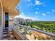 Expansive balcony overlooking the water and lush landscaping at 3060 Grand Bay Blvd # 175, Longboat Key, FL 34228