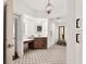 Spa-like bathroom with double vanity and patterned tile at 3060 Grand Bay Blvd # 175, Longboat Key, FL 34228