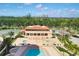 Aerial view of the clubhouse featuring a pool and spa at 3060 Grand Bay Blvd # 175, Longboat Key, FL 34228