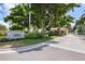 Grand Bay community entrance with gated access and lush landscaping at 3060 Grand Bay Blvd # 175, Longboat Key, FL 34228