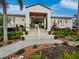 Home entrance with lush landscaping at 3314 Bayou Rd, Longboat Key, FL 34228