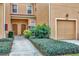 Townhouse entry with well-maintained landscaping at 3480 Parkridge Cir # 32-103, Sarasota, FL 34243