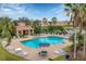 Resort-style pool and cabana area with surrounding landscaping at 3480 Parkridge Cir # 32-103, Sarasota, FL 34243