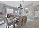 Dining room featuring a wood table, six chairs, and gray walls at 3510 49Th E Ave, Bradenton, FL 34203