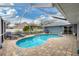 Enclosed pool and patio area with plenty of space for lounging at 3510 49Th E Ave, Bradenton, FL 34203